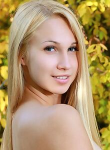 Shaved blonde teen cutie nude by a forest