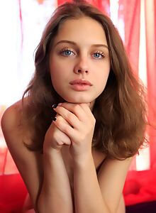 Blue-eyed teen Clarice shows off her small titties