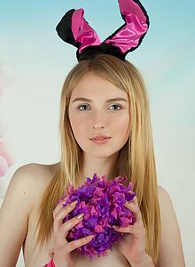 Flat-chested blonde teen dressed as a bunny