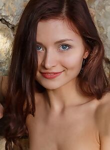 Shaved redhead teen spreading by a rock wall