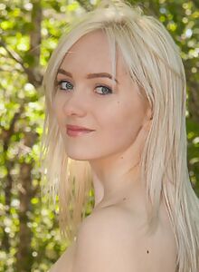 Shaved blonde with pale skin nude outdoors