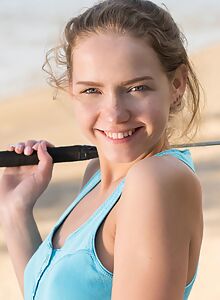 Cute blonde Faina Bona stripping at the beach