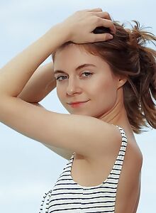 Cute redhead teen spreading by the pool