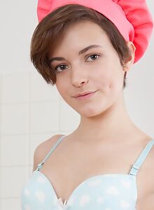 Brunette teen with short hair nude in the kitchen