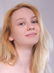 Blonde teen with pale skin in striped socks