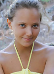 Cute shaved tanned teen nude outdoors