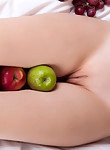 Brunette teen with apples by her shaved pussy