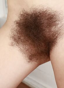 Hairy amateur spreads her thick hairy bush to take a piss