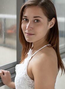 Freckled brunette spreading on the couch