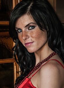 Freckled black-haired girl in lingerie