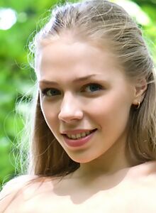 Smiling blonde teen nude outdoor