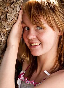 Flat-chested teen cutie climbing a tree