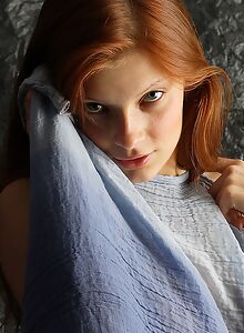 Lovely redhead teen posing naked