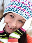 Blue-eyed teen stripping in the snow