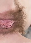 Hairy redhead plays with her big pussy lips