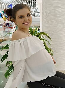 Pregnant brunette flashing some skin at the mall and showering