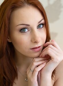 Athletic redhead with amazing green-eyes pulls down her see-through panties