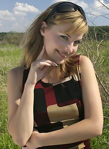 Sexy blonde nude by a river