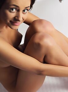 Tanned brunette teen nude in the bathtub
