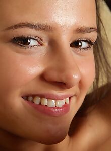 Adorable brunette takes off her dress and spreads her ass
