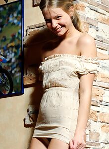 Cute blonde with puffy nipples lifts up her dress