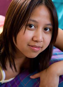 Exotic teen cutie with dark nipples