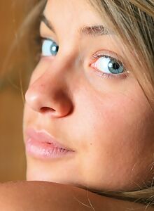 Cute girl with blue eyes shows off her big areolas