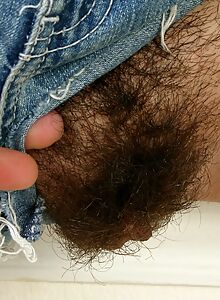 Nina's thick hairy bush pops out of her jean shorts