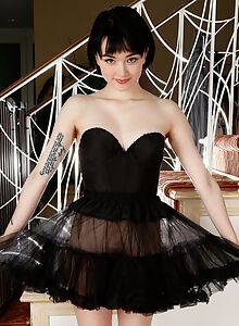 Black-haired teen shows off her bush
