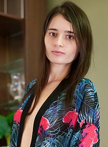 Shaved brunette amateur spreads her ass in stockings on the couch
