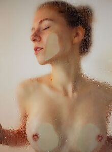 Cutest redhead with firm tits showering