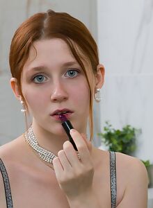 Shaved redhead with blue eyes spreads her ass in the shower