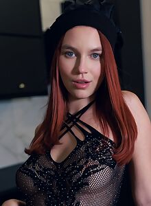 Shaved redhead in a fishnet dress