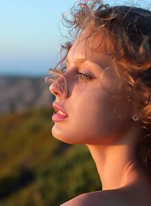 Flat-chested girl nude at sunset