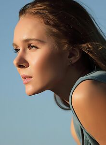 Sexy tattooed girl spreads her shaved pussy outdoors