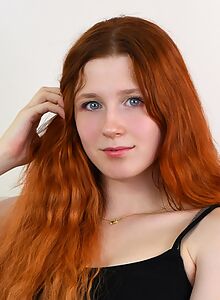 Cute redhead with blue eyes spreads her ass and pussy