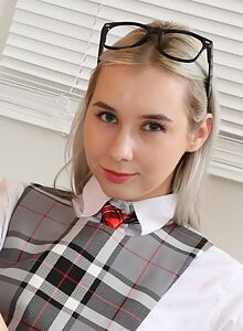 Nerdy blonde schoolgirl lifts up her plaid dress