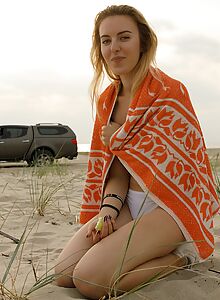 Lovely blonde topless in wet panties at the beach