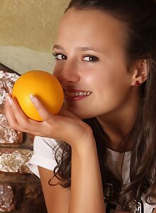 Cute brunette spreads her legs