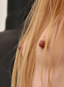 Flat-chested girl with long nipples posing nude