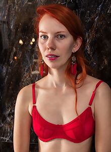 Freckled redhead takes off her lingerie