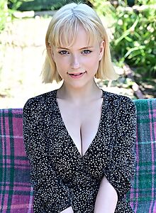 Busty blonde with huge areolas lifts up her dress