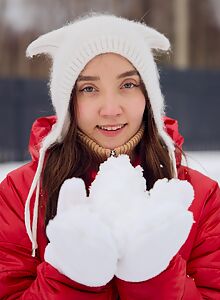 Brunette plays with her shaved pussy