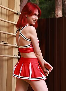 Shaved redhead cheerleader stripping by her house