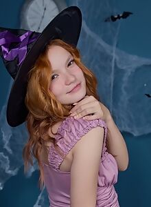 Cute redhead with puffy nipples in a witch costume