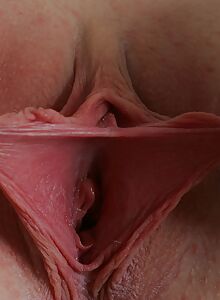 Blonde with big boobs spreads her ass and big pussy lips