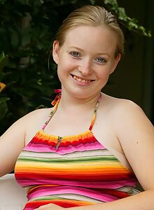 Chubby blonde with fair skin spreads her hairy pussy on a chair