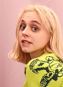 Cute shaved blonde spreads her ass and pussy in bed