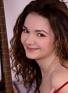 Chubby brunette fingering her shaved pussy