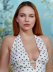 Redhead babe with big tits lifts up her dress